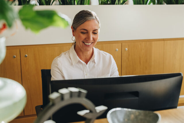 A front desk manager at a medical office configures Solutionreach automation to save time for focusing on patients and more important tasks.