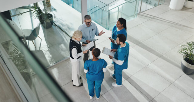 group of enterprise healthcare leaders collaborating image