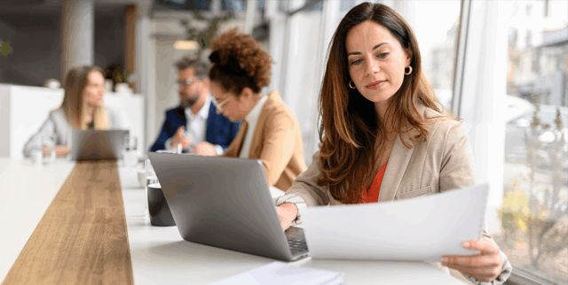 hero image of a woman working on performance reports