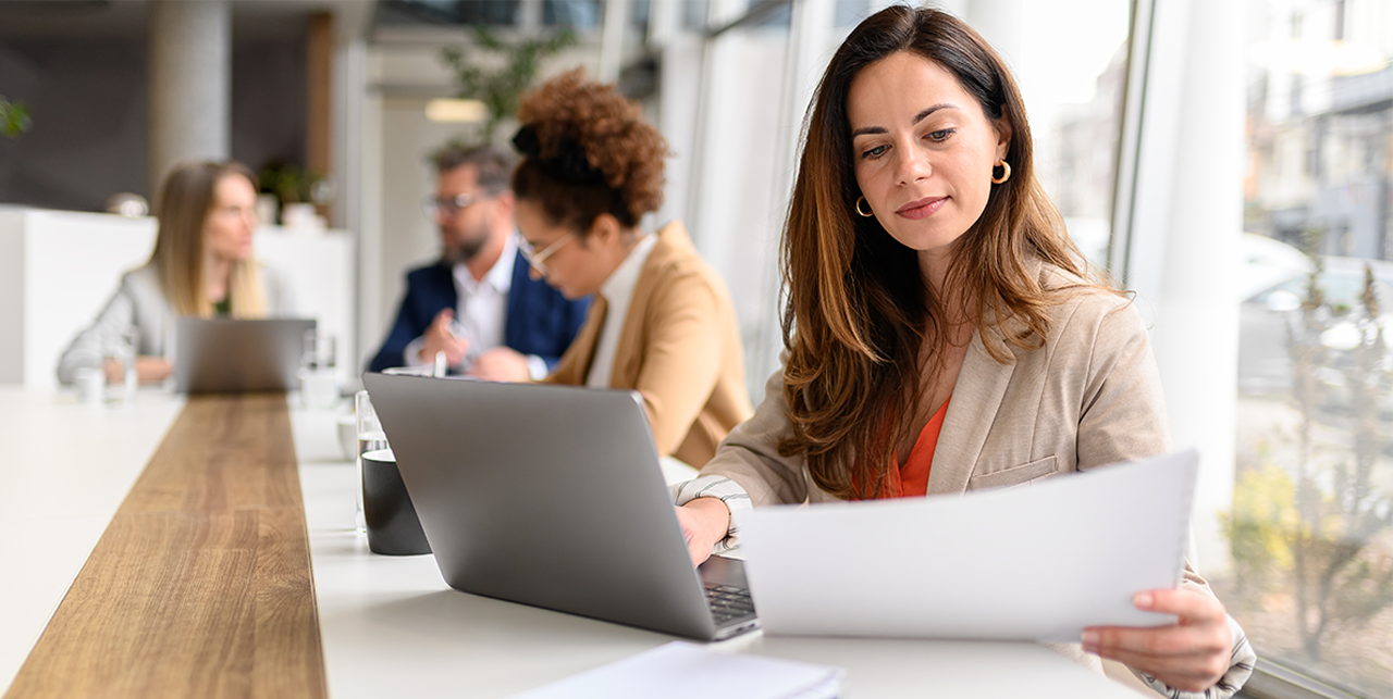 hero image of a woman working on performance reports