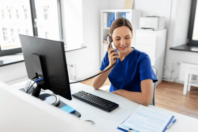 Healthcare staff member using Solutionreach technology to manage patient communication and appointment workflows.