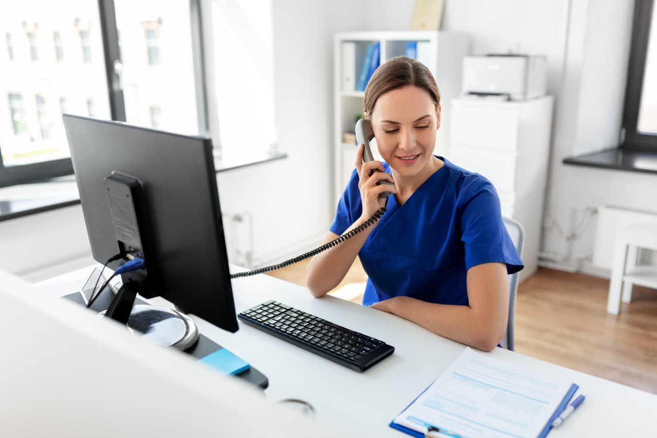 Healthcare staff member using Solutionreach technology to manage patient communication and appointment workflows.