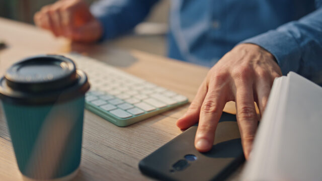 A patient reaches for their phone after an unanswered call, showing how missed calls can lead to lost scheduling opportunities when no voicemail is left—and how Solutionreach’s AI-powered Virtual Scheduling Assistant helps keep appointment requests moving.